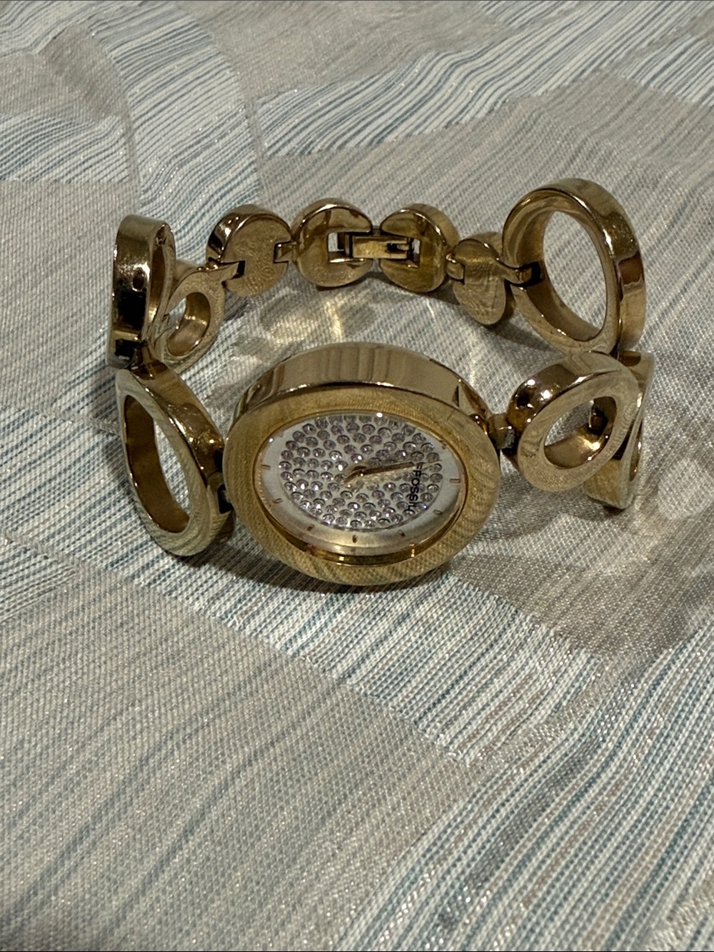Fossil gold and rhinestone circle watch